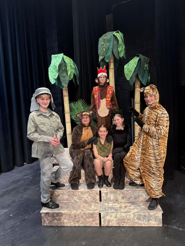 students in Jungle Book play on stage