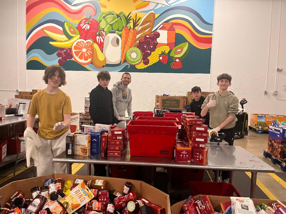 Chagrin Falls Middle School (CFMS) and Chagrin Falls Intermediate School (CFIS) families and staff once again demonstrated the power of generosity and service, helping collect more than 3,700 pounds of food and household items as part of the Cleveland Foodbank’s annual Harvest for Hunger Food Drive. The food drive was organized by the CFMS and CFIS Student Councils.  In partnership with the Chagrin Valley Fire Department, students, staff, and families across the district contributed donations to support local individuals and families facing food insecurity. The effort is part of a long-standing community tradition, with the fire department participating in the initiative for more than 20 years.  “We are incredibly grateful for the continued support,” said Jake Fried, firefighter/paramedic and Harvest for Hunger coordinator for the Chagrin Valley Fire Department. “Your generosity has made a meaningful impact on families in need throughout our region.”  Throughout the drive, students and staff collected nonperishable food items and essential household goods, reinforcing lessons of service, compassion, and community responsibility.   The Harvest for Hunger campaign benefits the Greater Cleveland Food Bank and its network of partner agencies, helping ensure that thousands of Northeast Ohio residents have access to nutritious food.