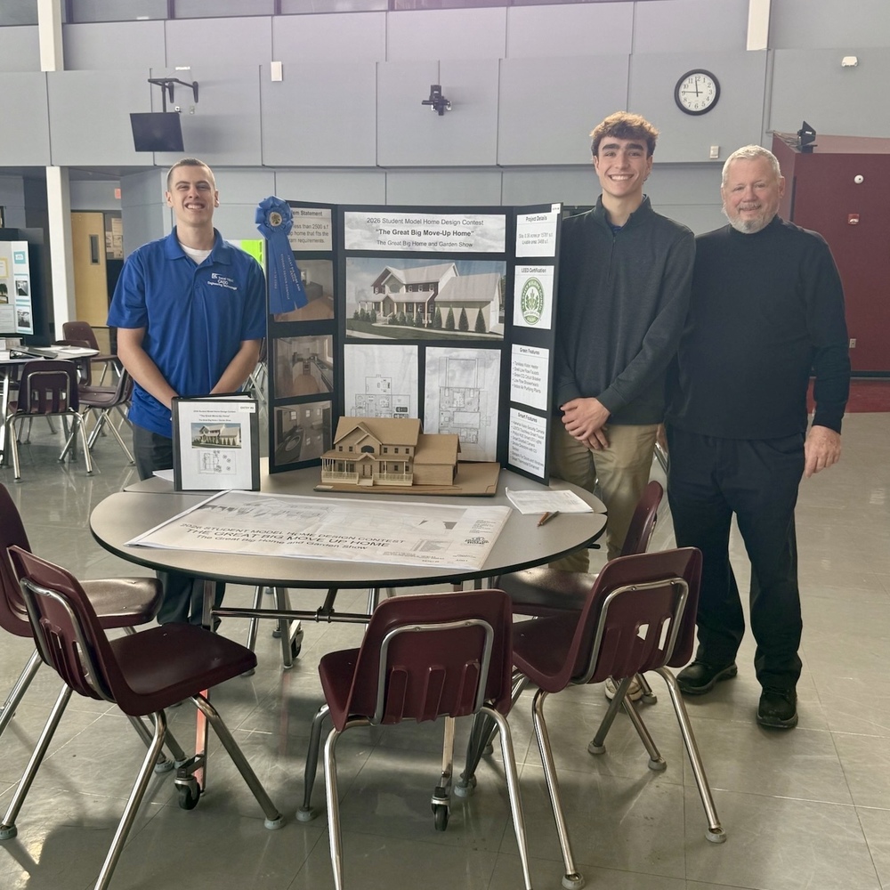 students who won and award with their teacher