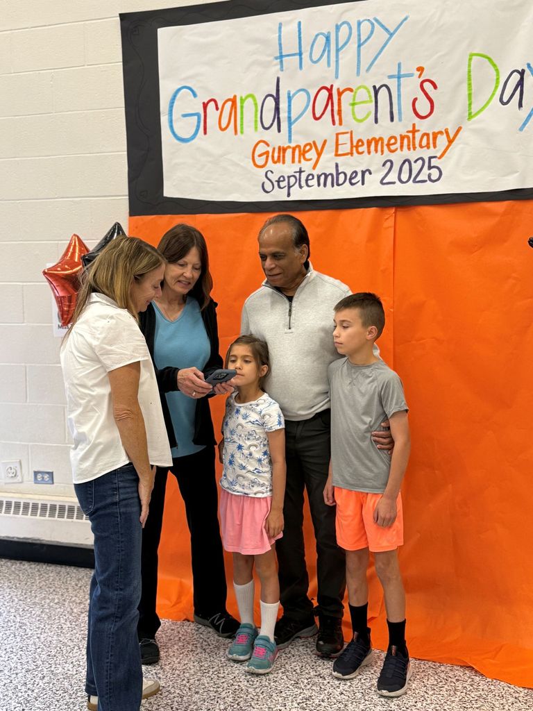 Gurney love grandparents day, students coloring and sharing a snack with loved ones.