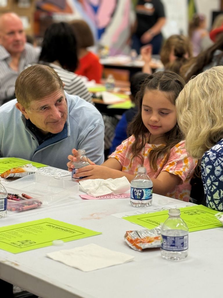 Gurney love grandparents day, students coloring and sharing a snack with loved ones.