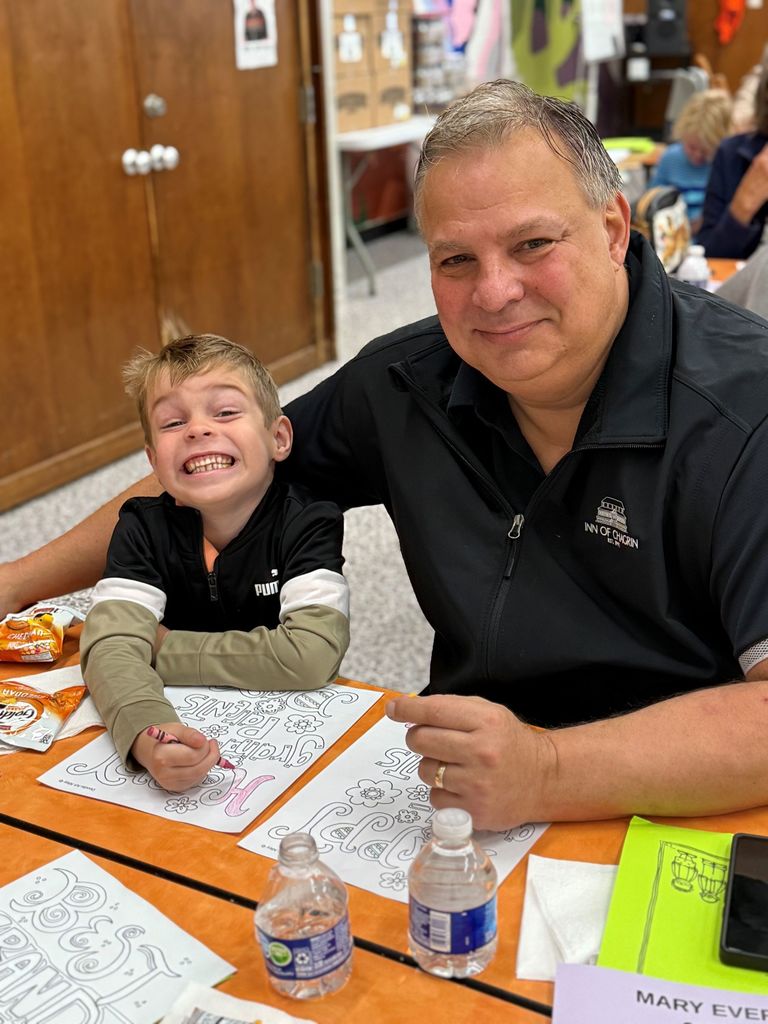 Gurney love grandparents day, students coloring and sharing a snack with loved ones.
