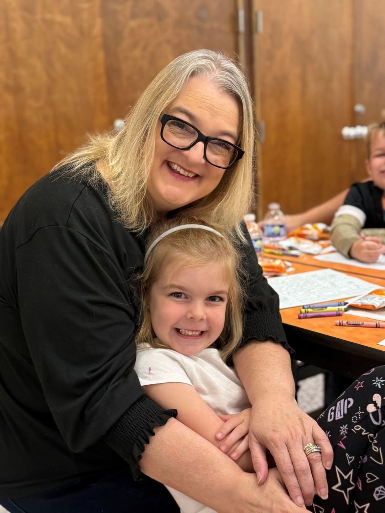 Gurney love grandparents day, students coloring and sharing a snack with loved ones.