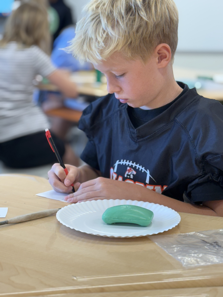 4th grade students carve soap as part of their ELA class to share an experience with the main character.