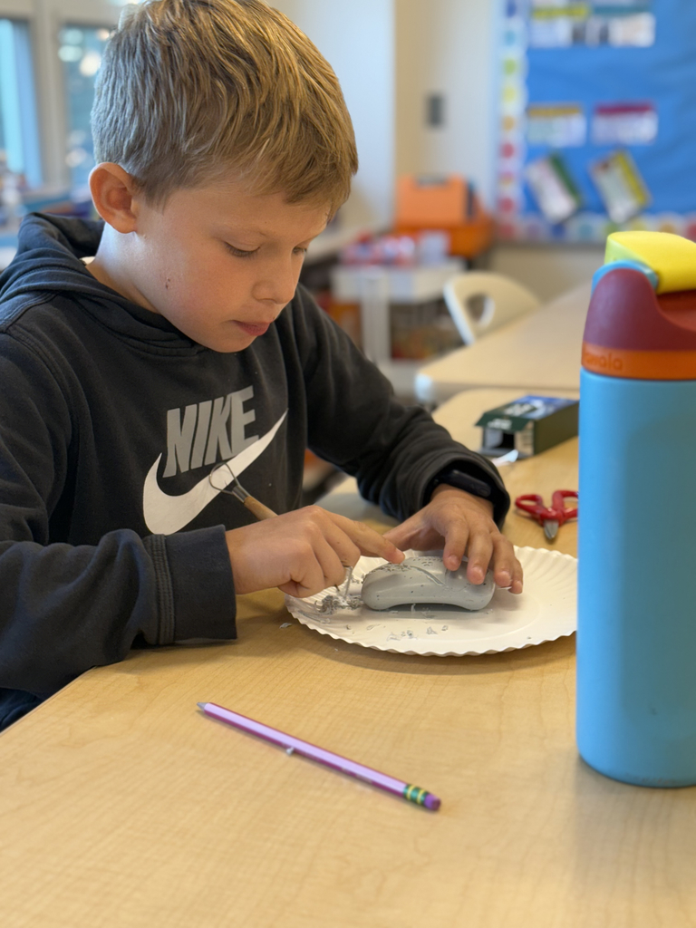 4th grade students carve soap as part of their ELA class to share an experience with the main character.