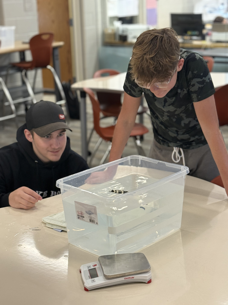 Using hot glue, students experimented with items like beads, hardware, popsicle sticks, and balloons to adjust balance and achieve neutral buoyancy.