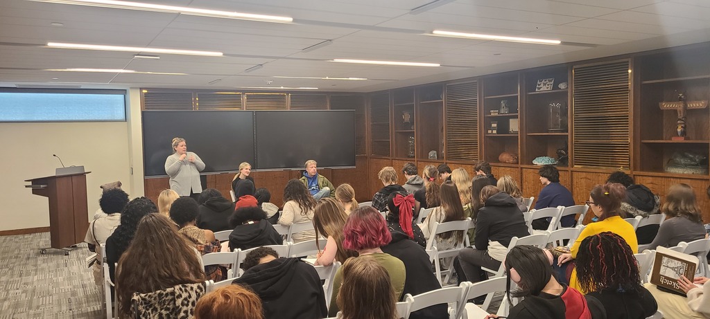 Art students explore the natural history museum with their sketchbooks. 