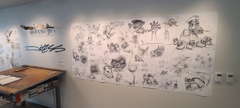 Art students explore the natural history museum with their sketchbooks. 