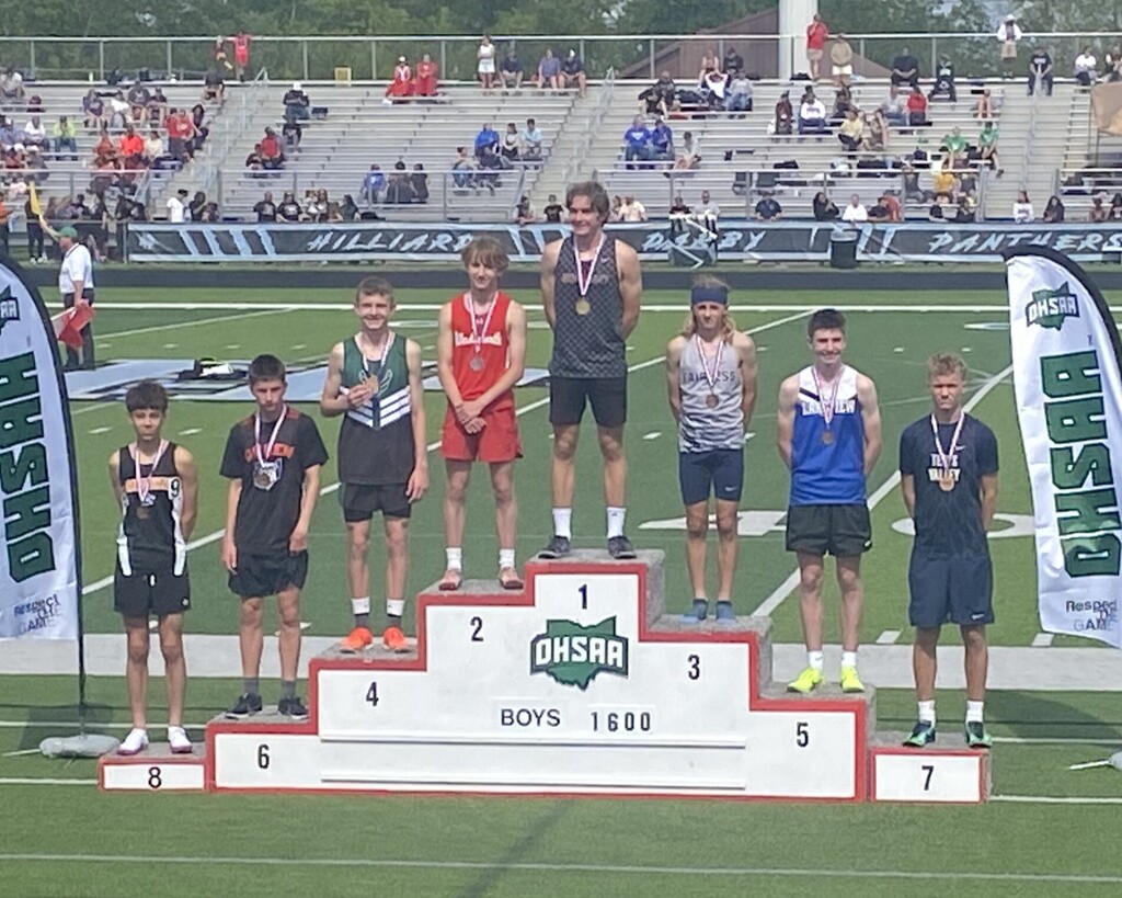 Middle School 1600m track medal podium. 