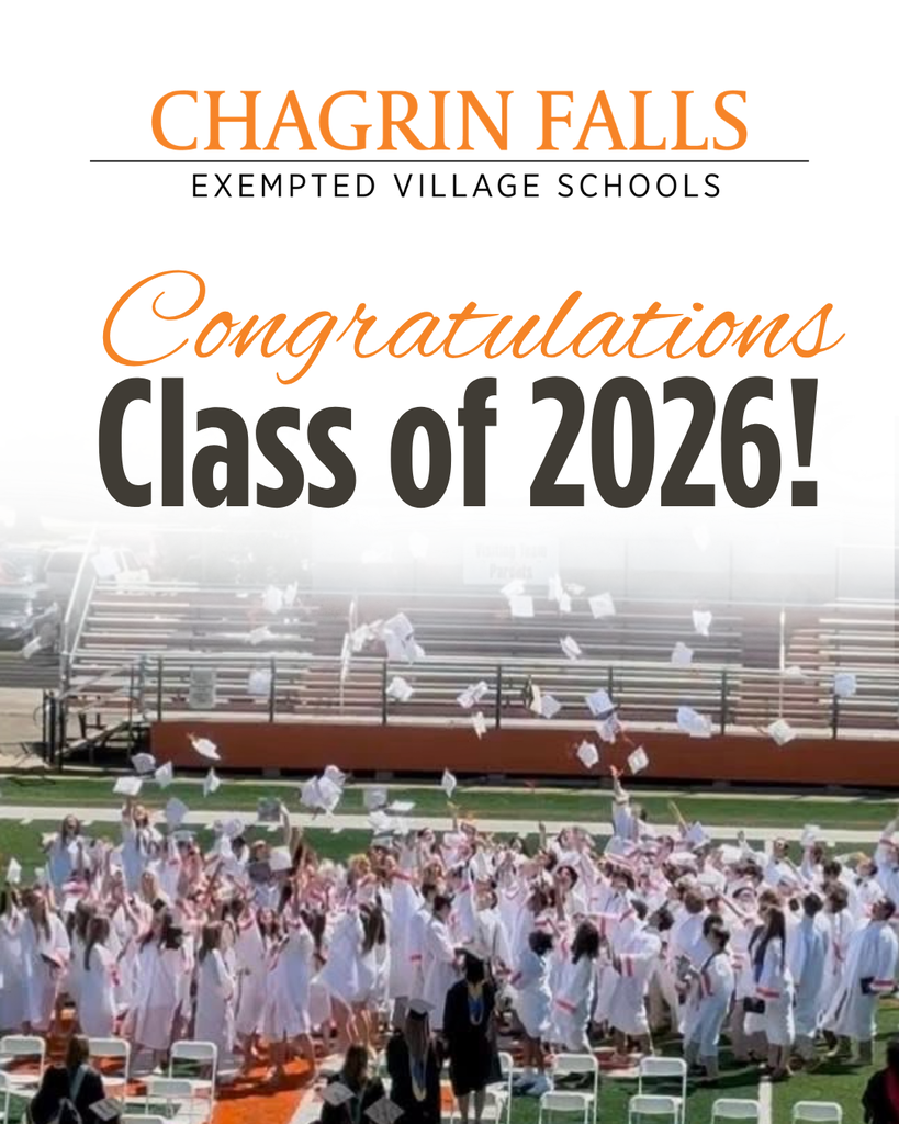 graduates throwing caps on the football field
