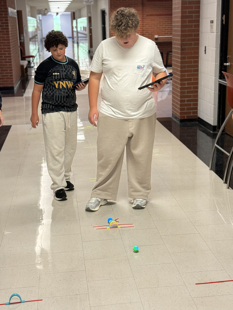8th grade students program Spheros Robots for croquet course.