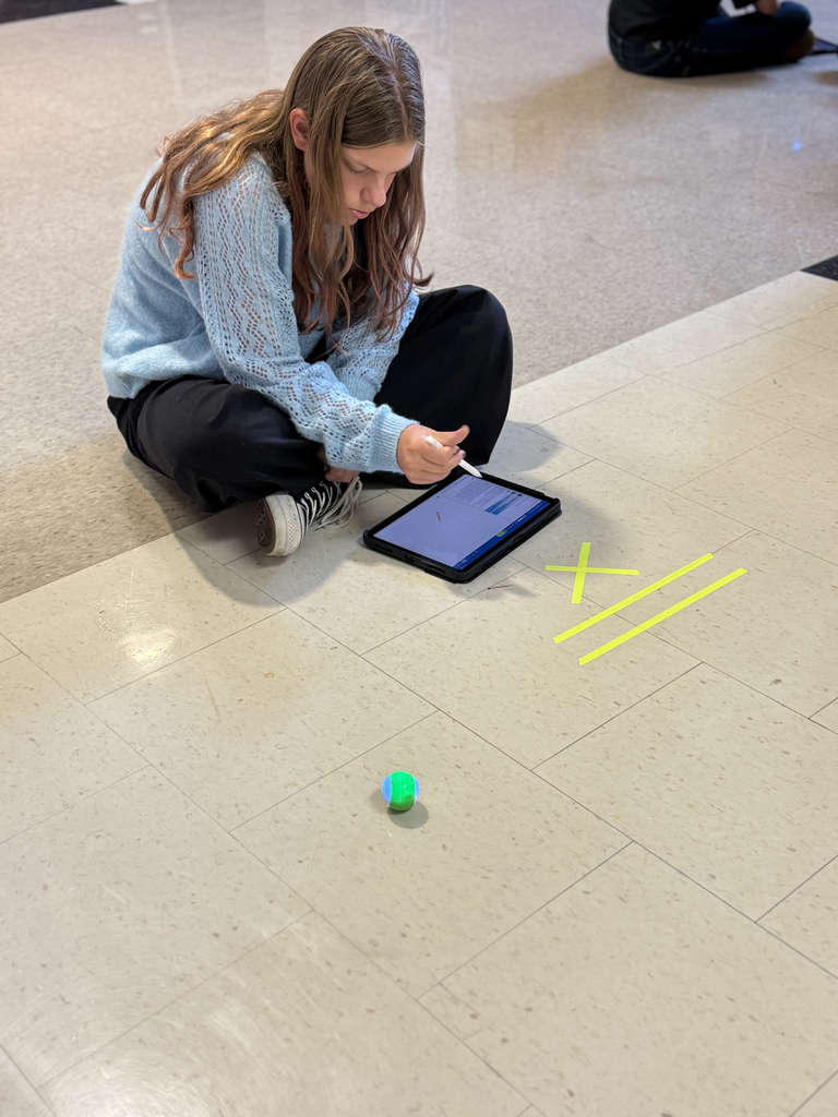 8th grade students program Spheros Robots for croquet course.