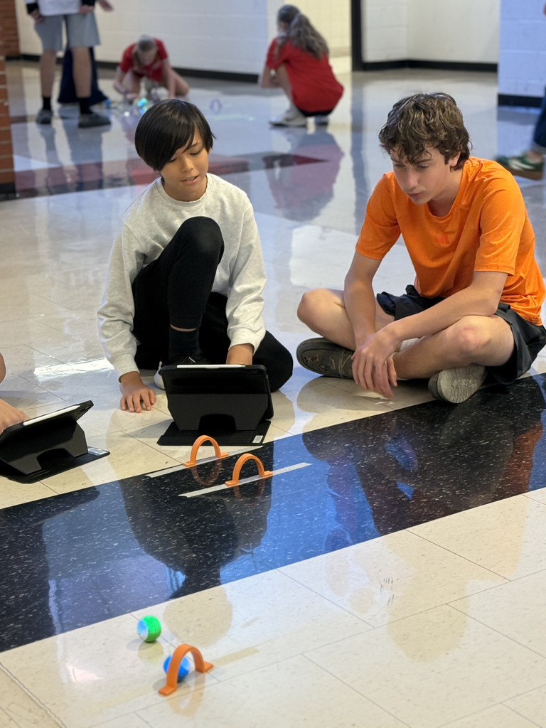 8th grade students program Spheros Robots for croquet course.