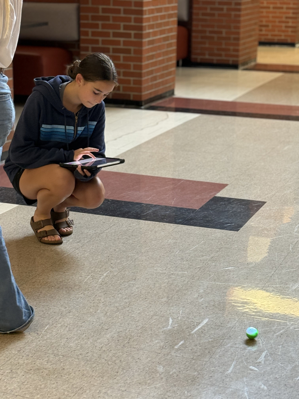 8th grade students work with spheros robots