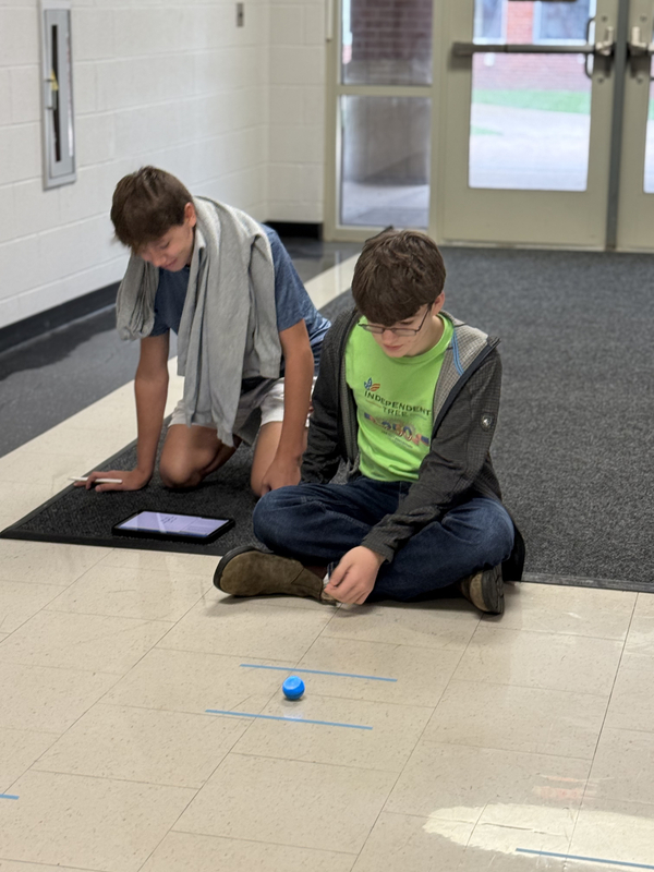 8th grade students work with spheros robots