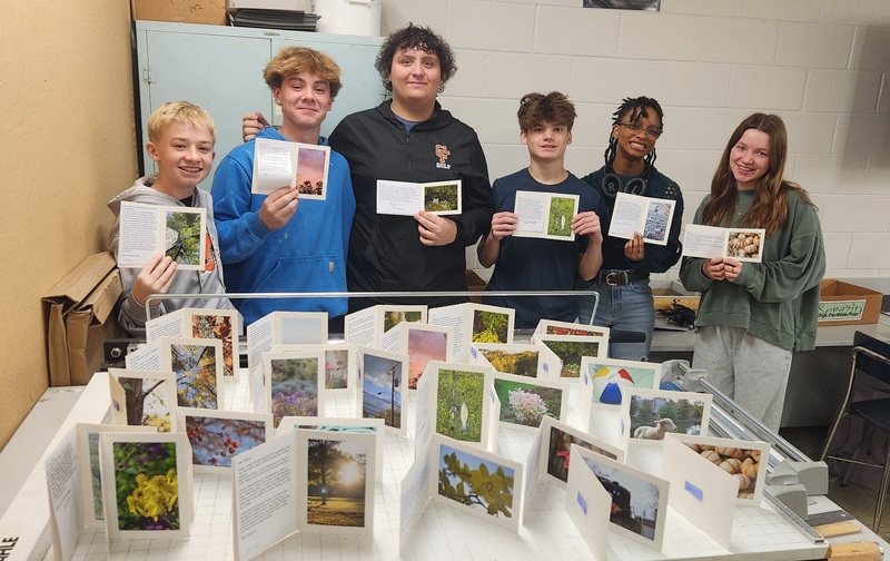 Students working together to assemble bags to give to those in need.