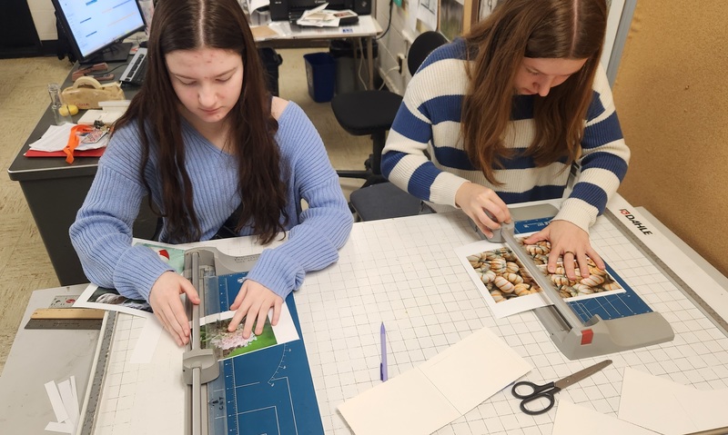 Students working together to assemble bags to give to those in need.