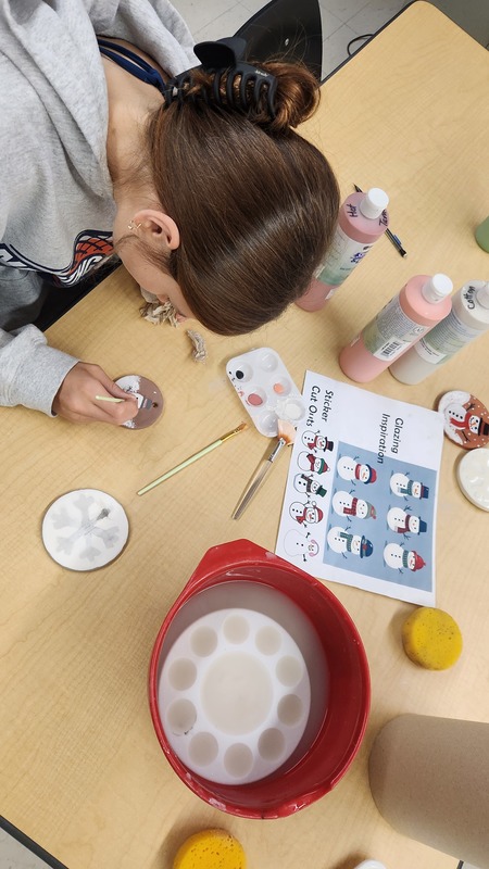 Students working together to assemble bags to give to those in need.