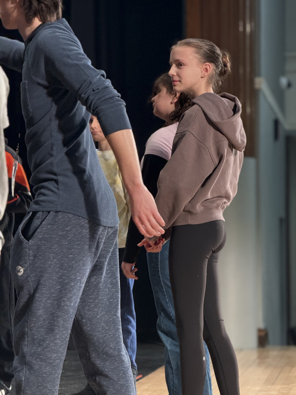 6th grade students participating in a great lakes theater residency. playing theater games to warmup. 