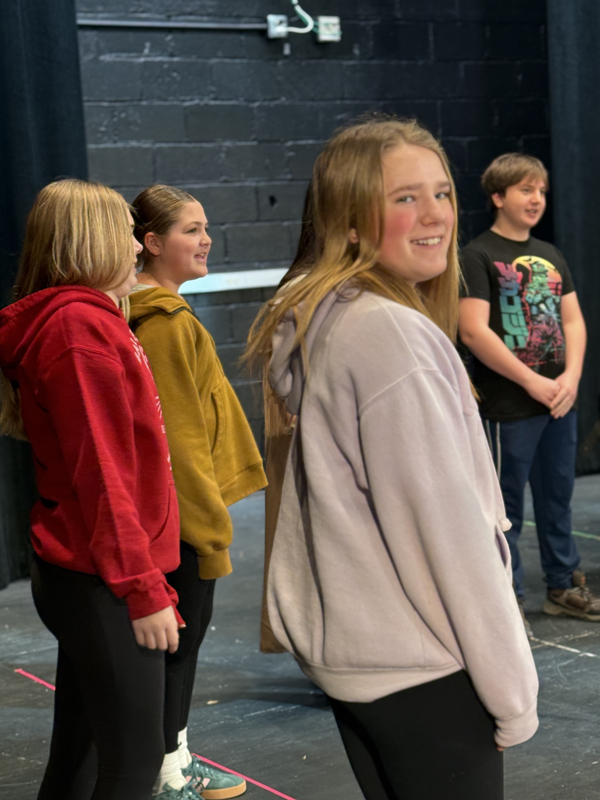 6th grade students participating in a great lakes theater residency. playing theater games to warmup. 