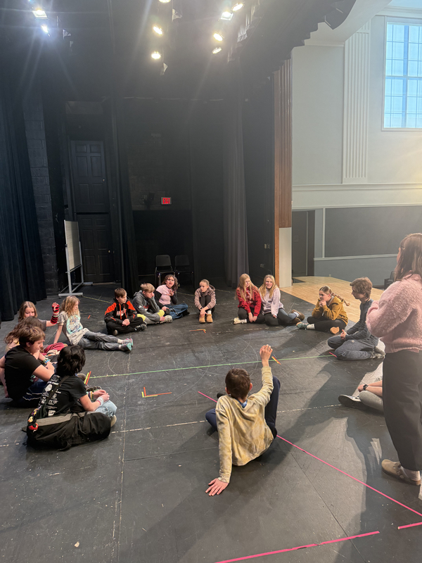 6th grade students participating in a great lakes theater residency. playing theater games to warmup. 