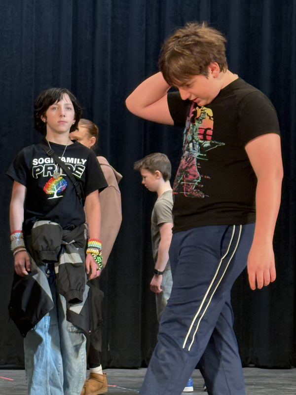 6th grade students participating in a great lakes theater residency. playing theater games to warmup. 