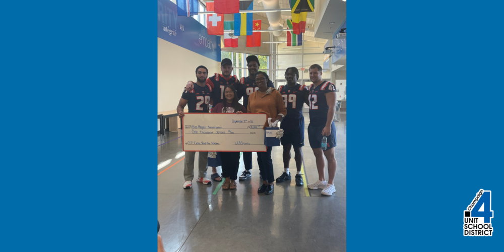 Fighting Illini football team with Dr. Asia Fuller and Megan Nierenhasuen