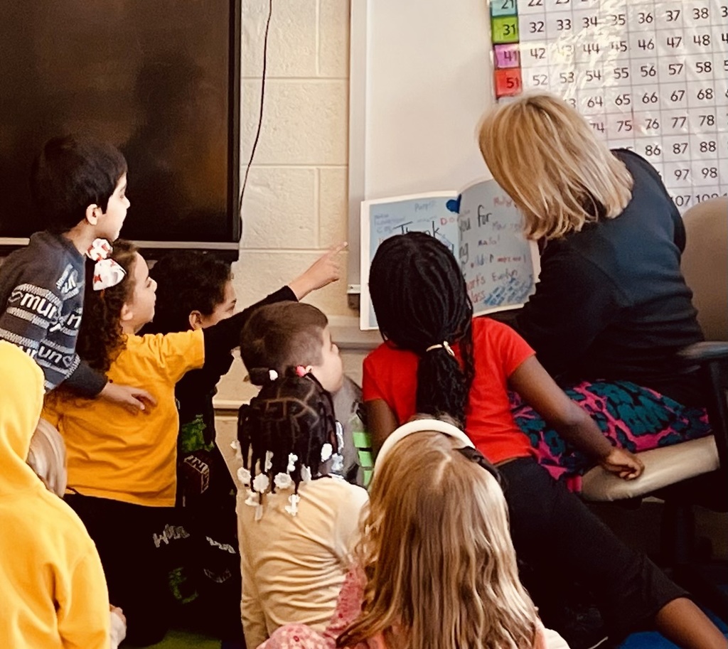 Nikki Budzinski reading to elementary school students
