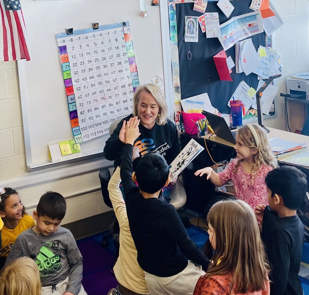 Nikki Budzinski reading to elementary school students