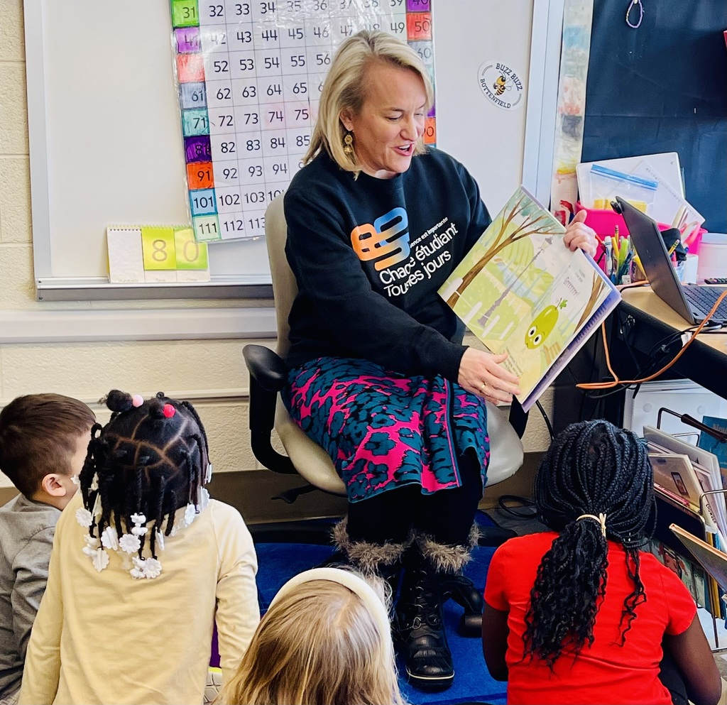 Nikki Budzinski reading to elementary school students