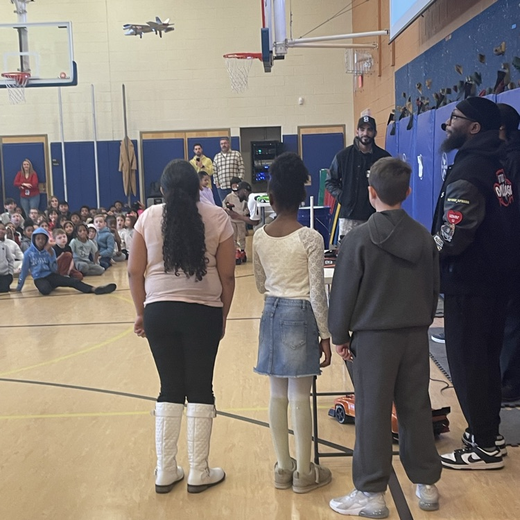 Bottenfield students flying a drone with street college