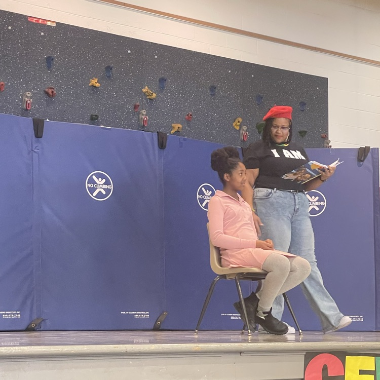 Westview teacher and student read poetry at their NAAPID assembly 