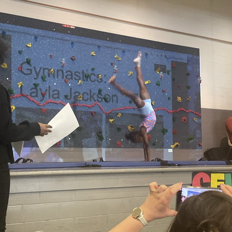 Westview student performs gymnastics at their NAAPID assembly 