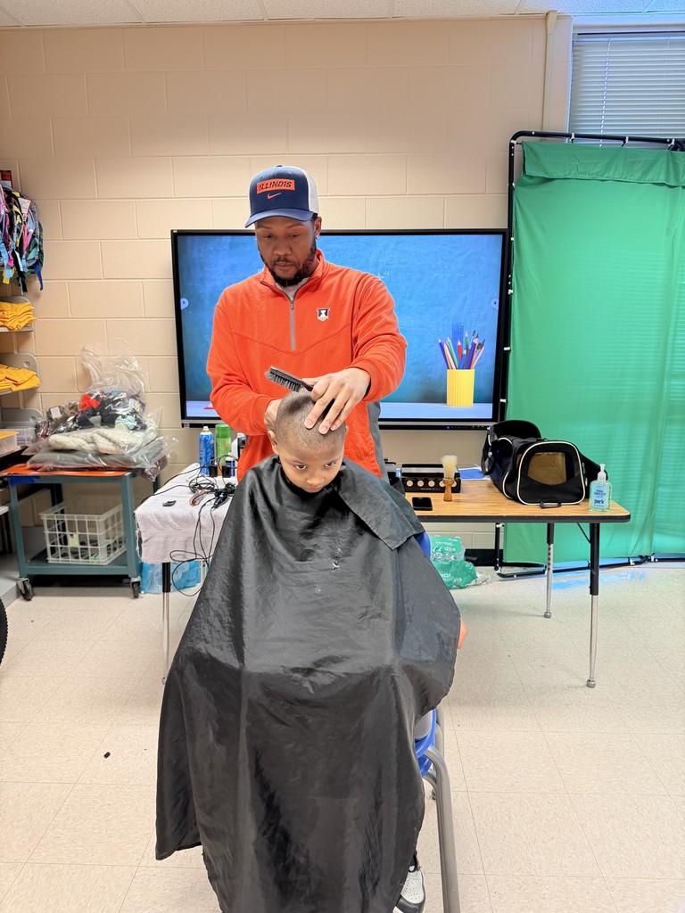 Student receives a free haircut for NAAPID at Stratton