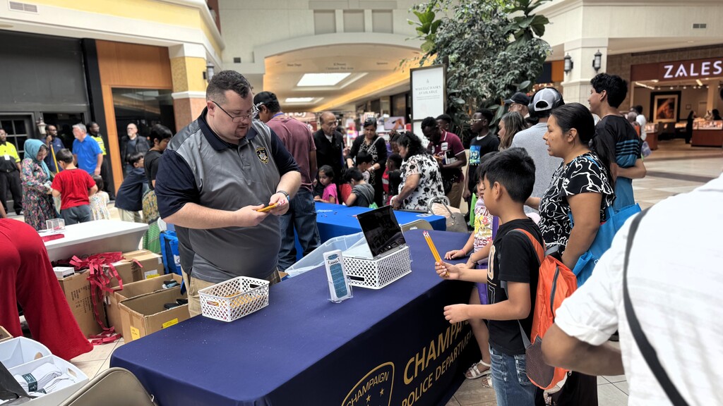 Champaign Police Department handing out school supplies to families.