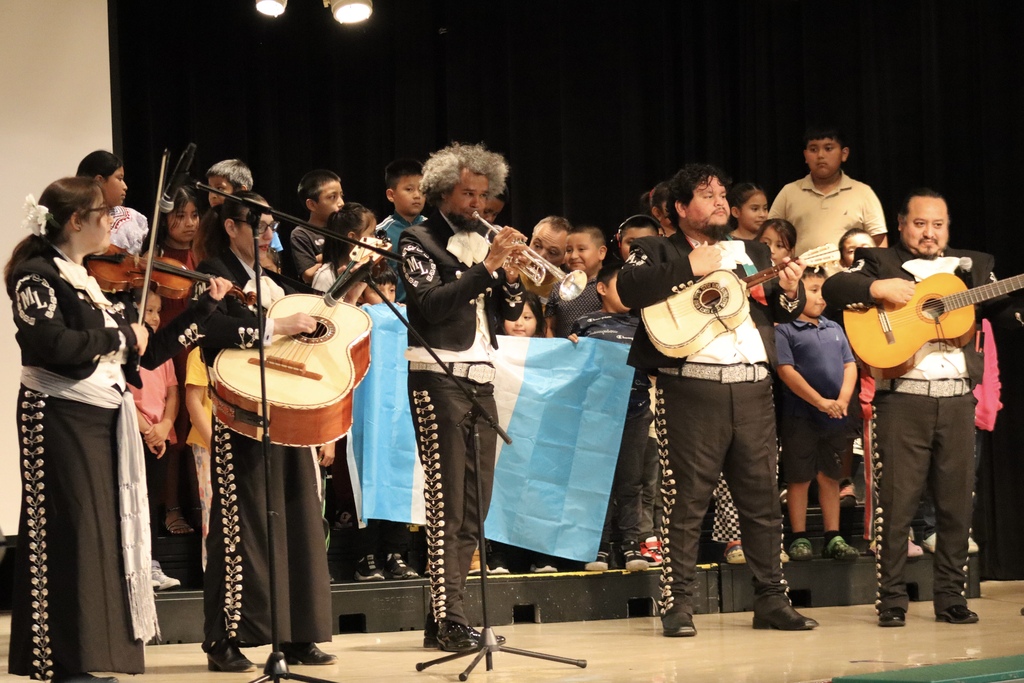 Mariachi Libertad performs in front of students at Stratton Academy of the Arts during a National Hispanic Heritage Assembly.