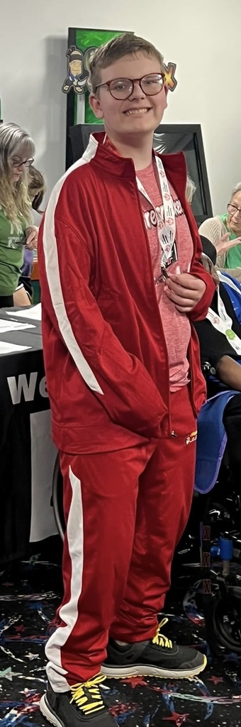 A Unit 4 student poses for a photo at the Special Olympics.