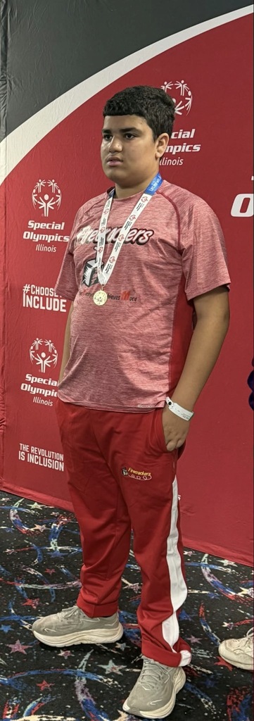 A Unit 4 student poses for a photo at the Special Olympic competition.