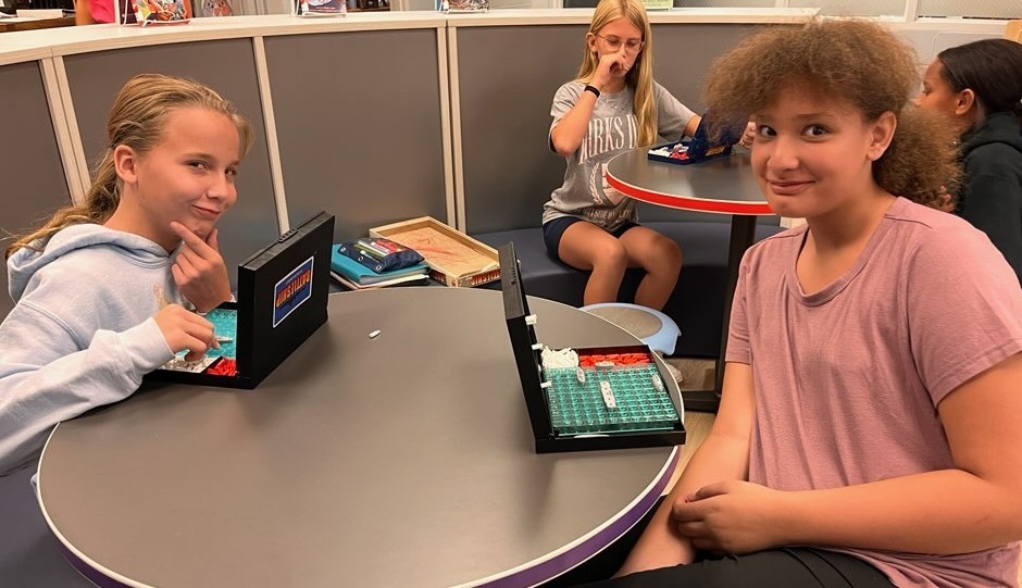 A friendly game of Battleship between friends.