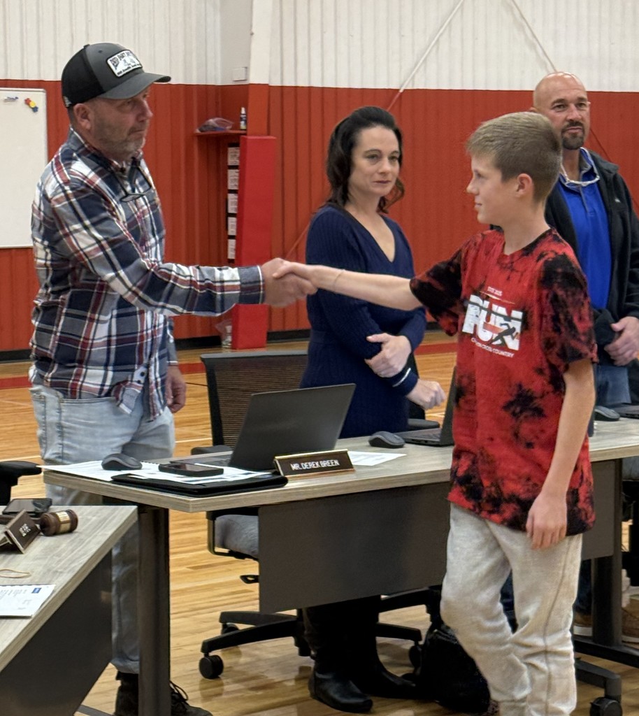 Board of Education congratulating Cross Country team.