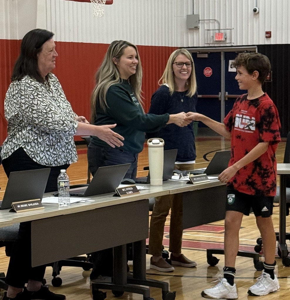 Board of Education congratulating Cross Country Team