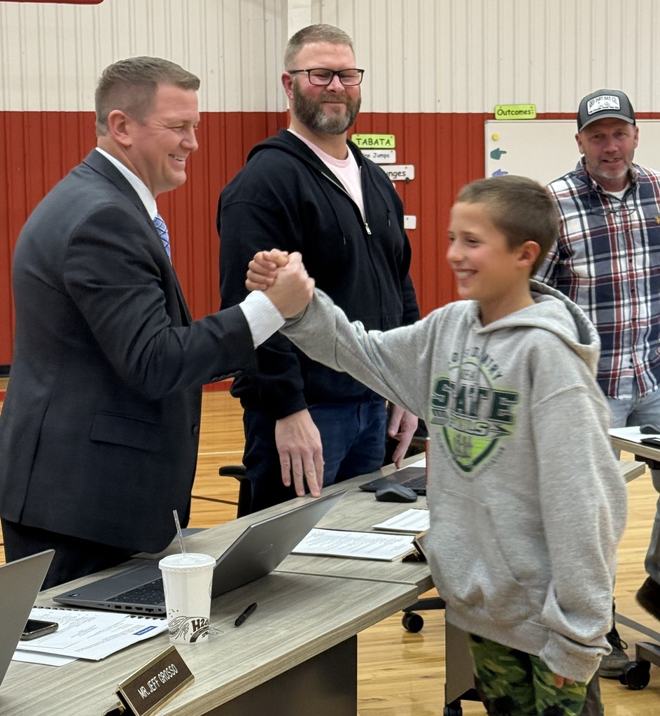 Board of Education congratulating Cross Country team.