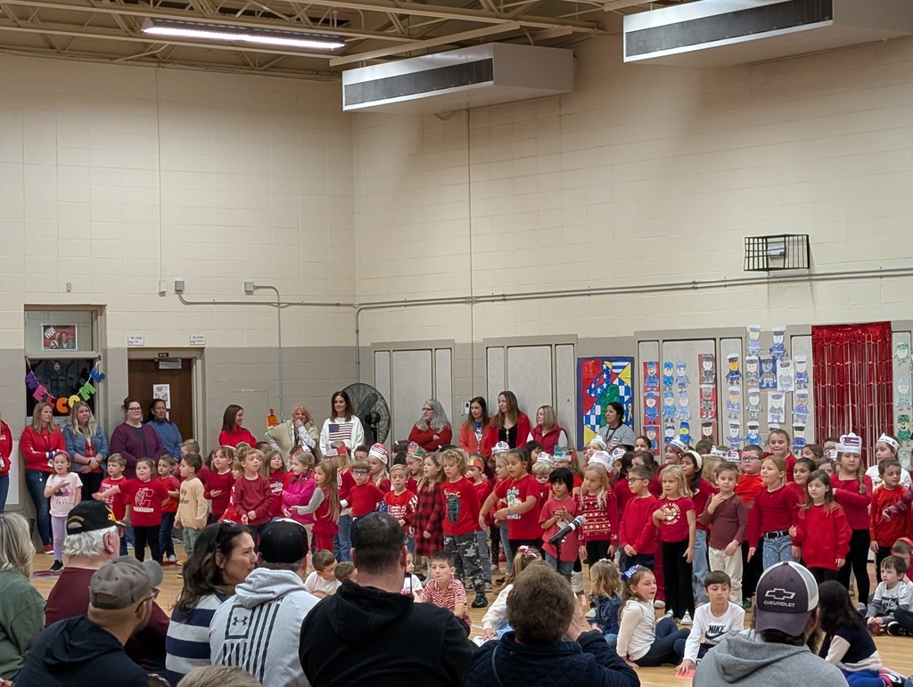 students singing to veterans