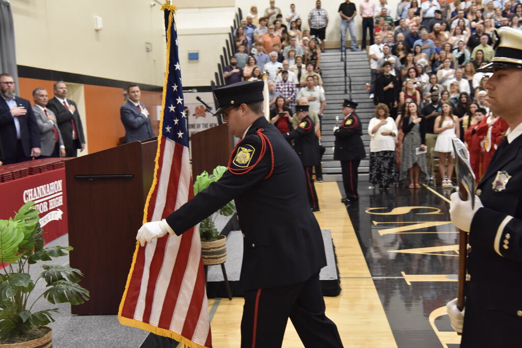 Mr. Mustoe presenting the colors