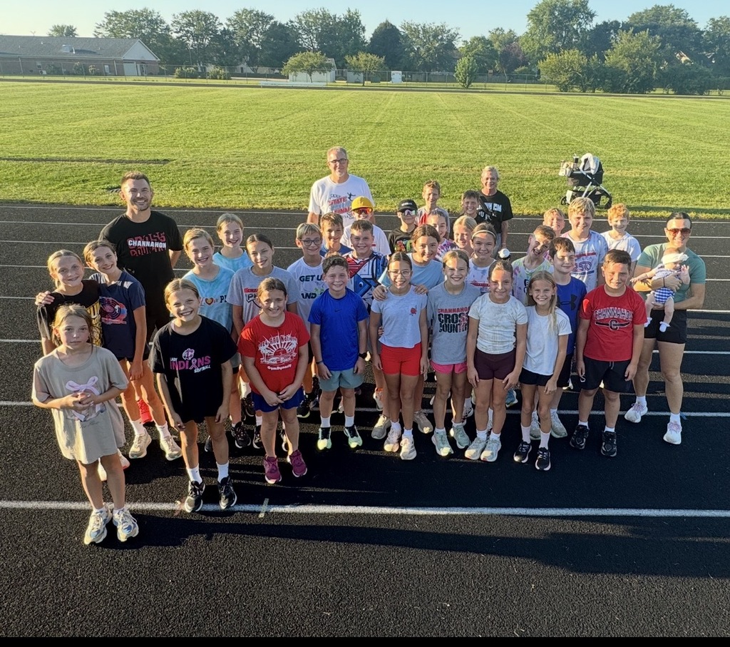 Photo of cross country runners and coaches on track