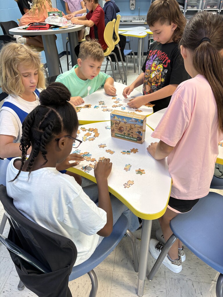 students working on puzzle