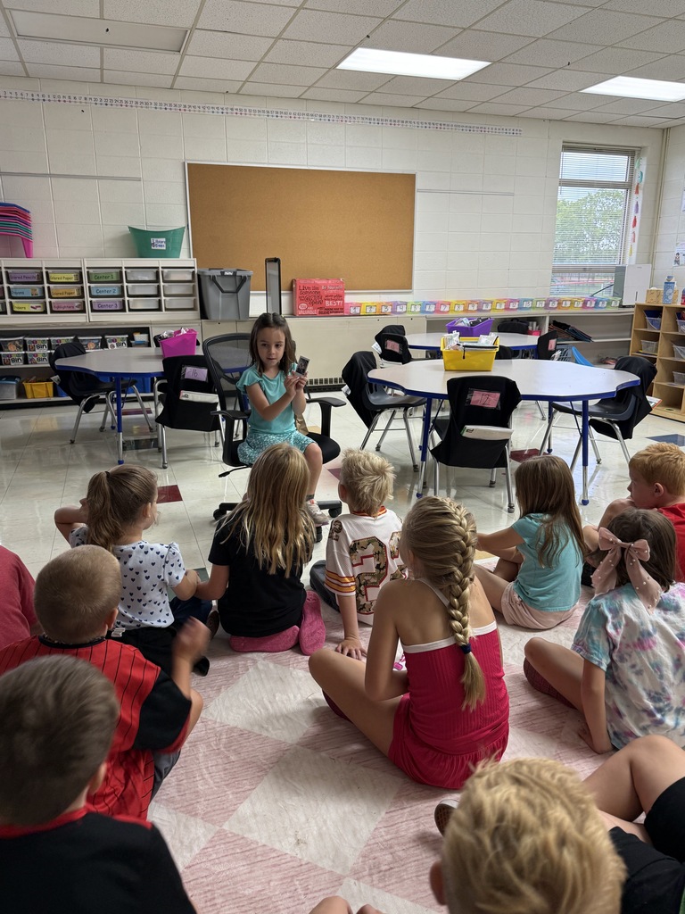 STUDENT SHOWING CLASS FAVORITE ITEMS