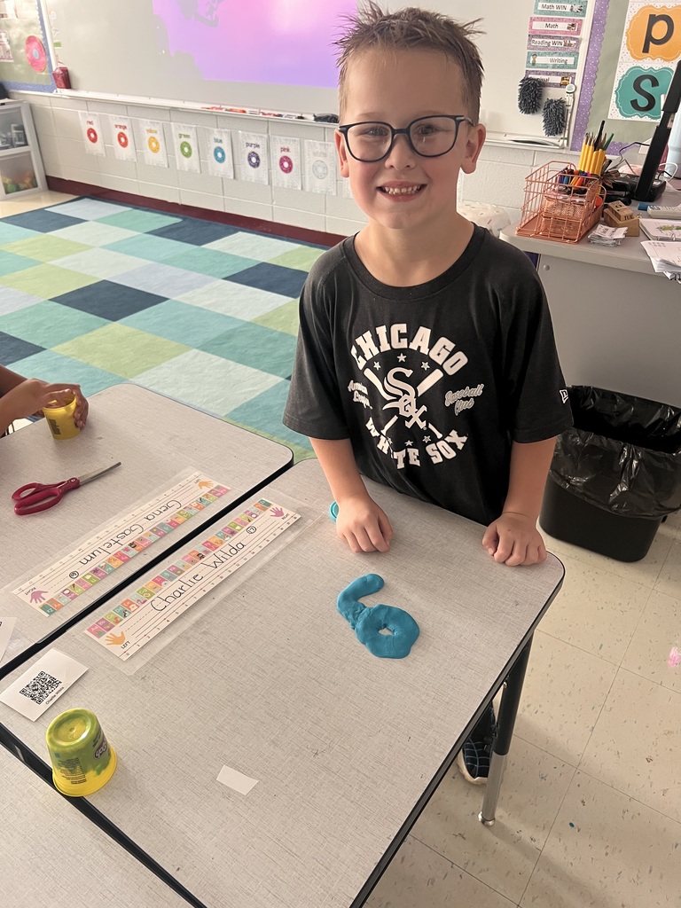 student with Play-doh numbers