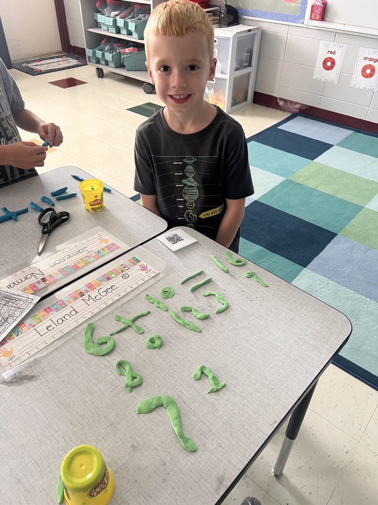 student with Play-doh numbers