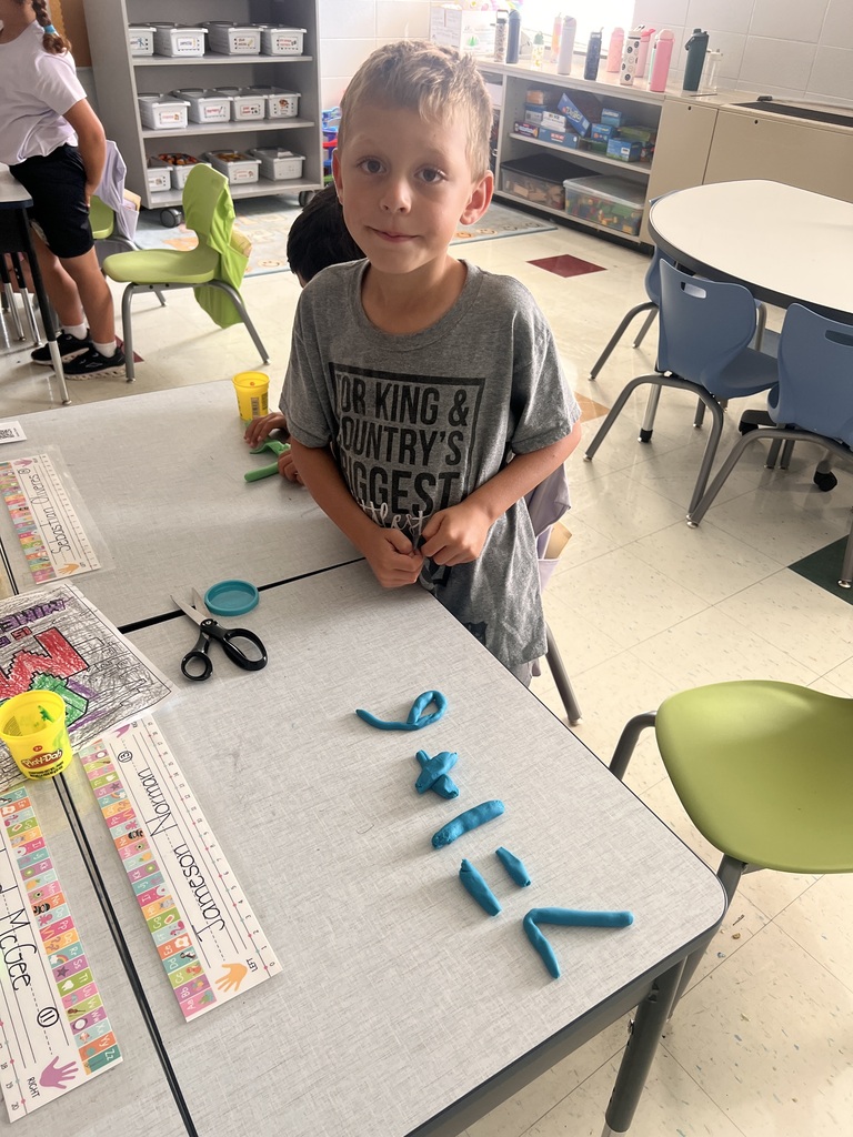 student with Play-doh numbers